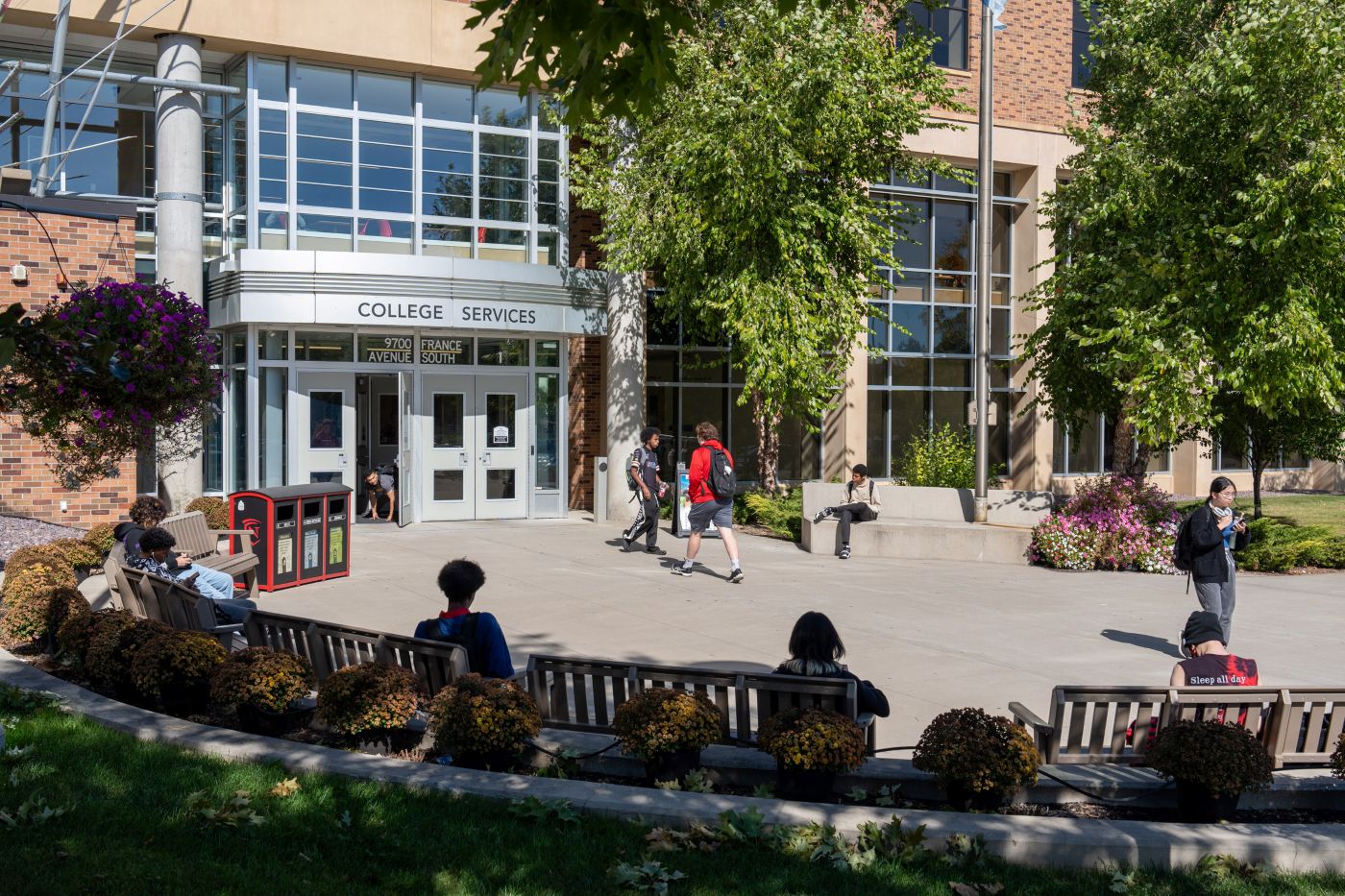 Photo of Normandale's Front Entrance with students